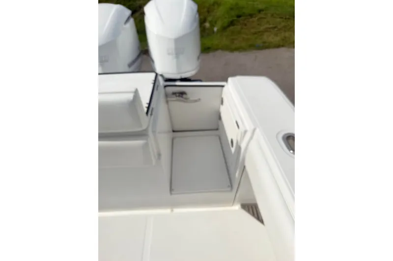 Slide: The Image of 2012 Bahama 37 boat deck with triple outboard engines. - 17