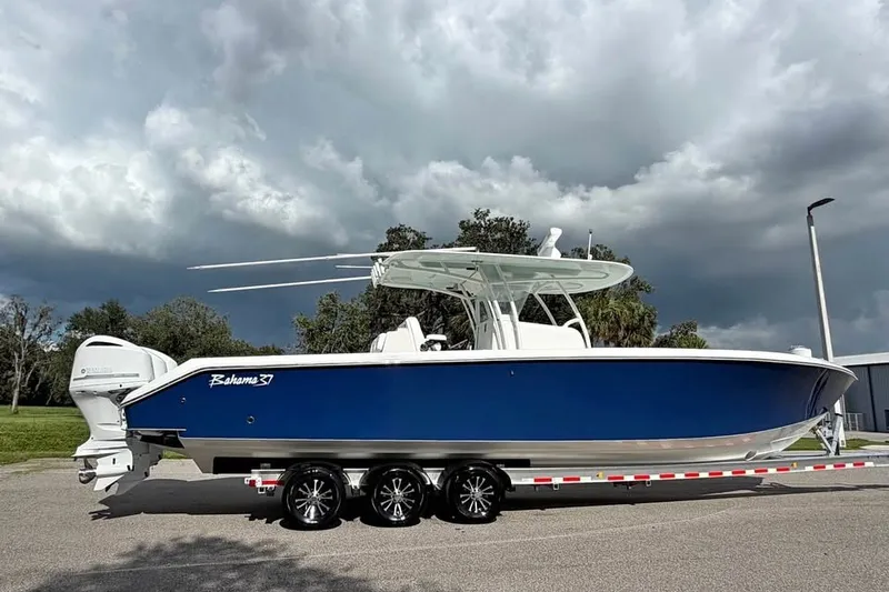 The Image of 2012 Bahama 37 boat on trailer under cloudy sky. - 0