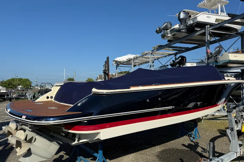 Slide: The Image of 2018 Chris-Craft Launch 30 boat on dry dock, covered and ready for storage. - 9