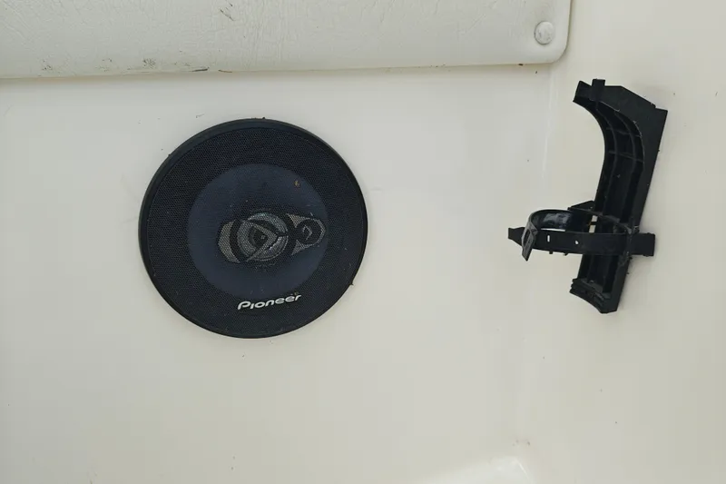 Slide: The Image of Pioneer speaker and broken holder inside 1996 SportsCraft 232HT boat. - 23