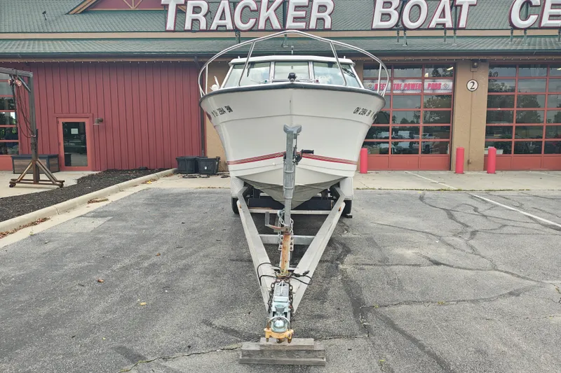 Slide: The Image of 1996 SportsCraft 232HT boat on trailer outside Tracker Boat Center. - 4
