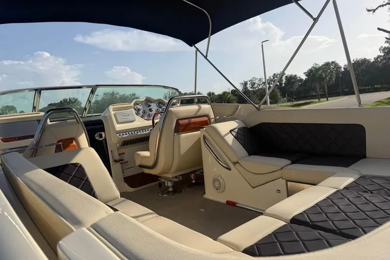 Slide: The Image of 2018 Chris-Craft Corsair 30 interior with luxurious seating and modern dashboard. - 15