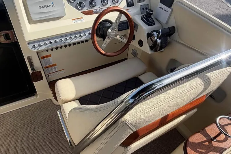 Slide: The Image of 2018 Chris-Craft Corsair 30 cockpit with Garmin navigation and luxurious leather seating. - 14