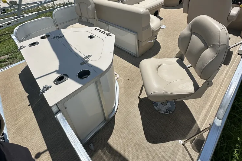 Slide: The Image of 2018 Berkshire 22RFC CTS pontoon boat interior with seating and table setup. - 6