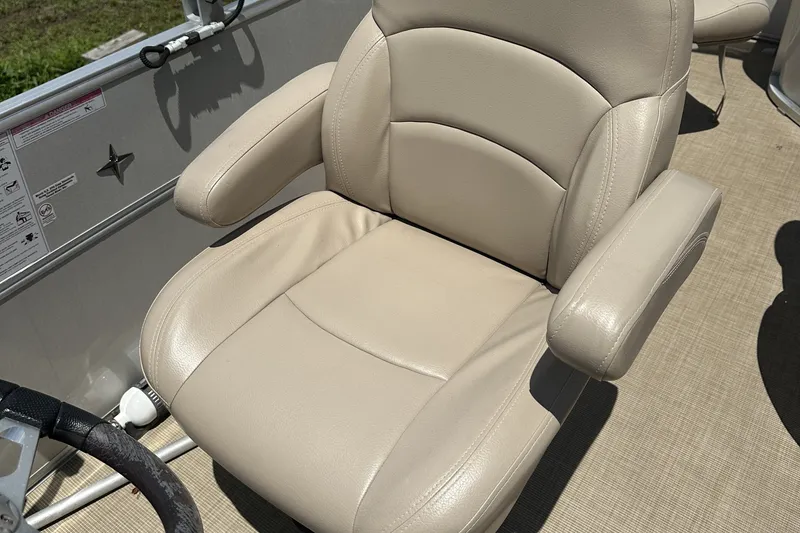 Slide: The Image of Beige captain's chair on 2018 Berkshire 22RFC CTS boat, featuring armrests and cushioned seating. - 9