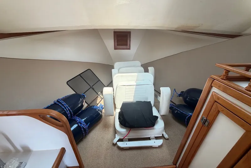 Slide: The Image of Interior of 1999 Judge Eastern 31 Flybridge with seating and nautical equipment. - 10