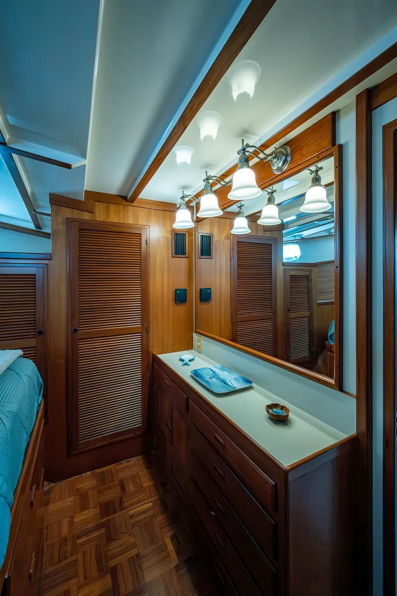 Slide: The Image of Kadey-Krogen 48 North Sea 2000 yacht interior with wooden cabinetry and elegant lighting. - 37
