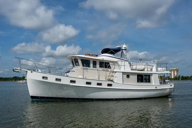 Slide: The Image of Kadey-Krogen 48 North Sea yacht, 2000 model, cruising on calm waters under a partly cloudy sky. - 6