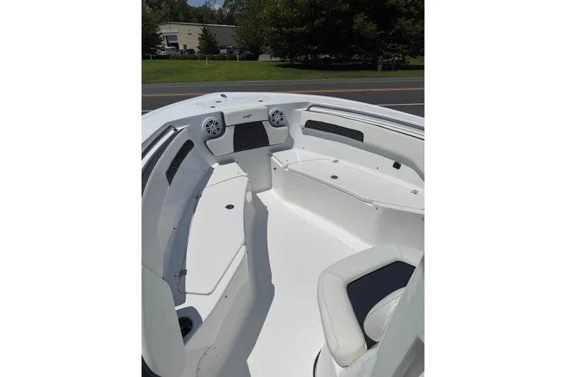 Slide: The Image of 2027 Tidewater 220 CC Adventure boat interior with seating and speakers. - 4