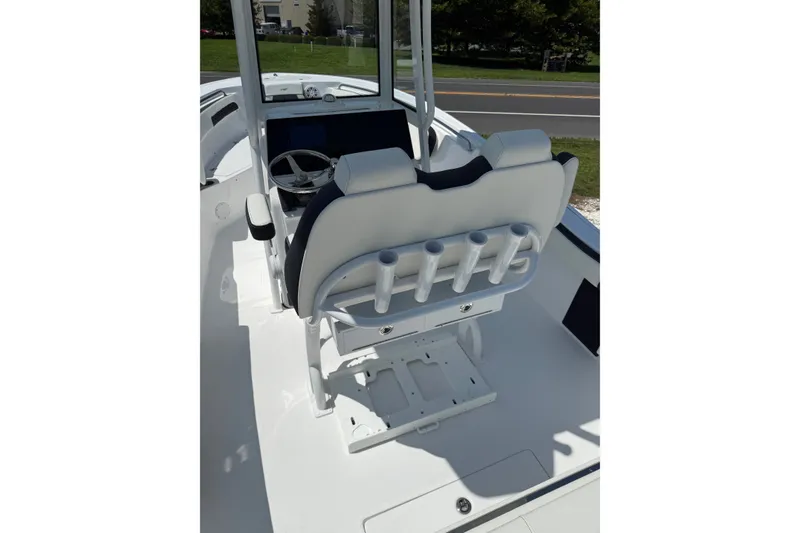 Slide: The Image of 2027 Tidewater 220 CC Adventure boat interior with helm and seating. - 5