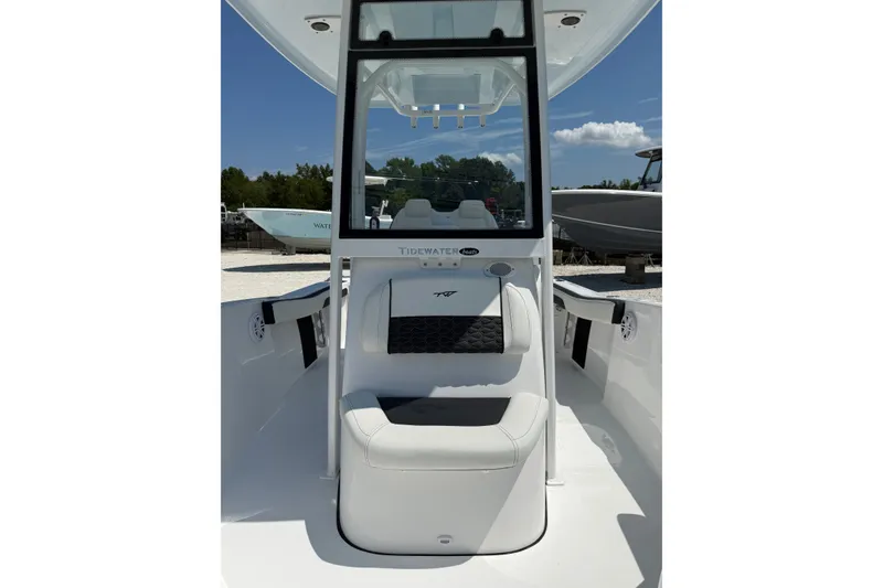 Slide: The Image of 2027 Tidewater 220 CC Adventure boat interior with seating and console view. - 7