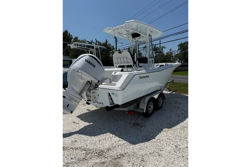 The Image of 2027 Tidewater 220 CC Adventure boat with Yamaha engine on a trailer. - 0