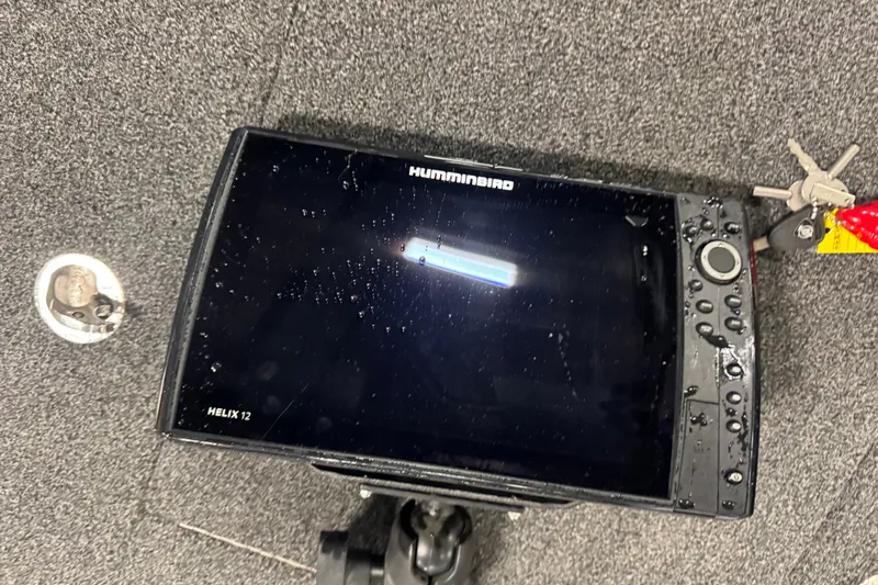 Slide: The Image of Humminbird Helix 12 fish finder on a 2019 Nitro ZV19 boat dashboard. - 19