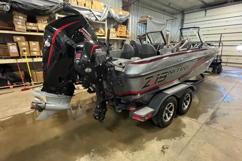 Slide: The Image of 2019 Nitro ZV19 boat in a garage, featuring dual Mercury engines. - 3