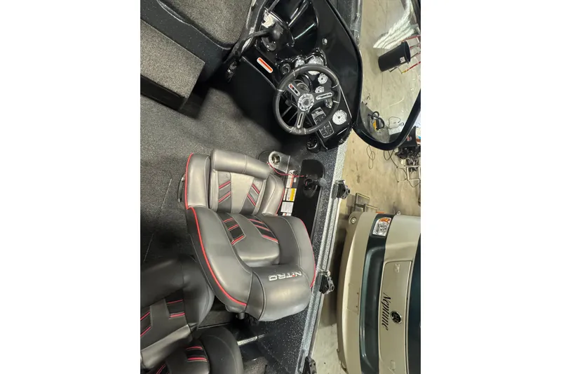 Slide: The Image of 2019 Nitro ZV19 boat interior with steering wheel and branded seats. - 6