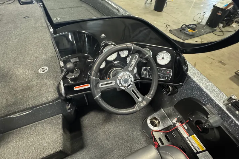 Slide: The Image of 2019 Nitro ZV19 boat cockpit with steering wheel and control panel. - 7