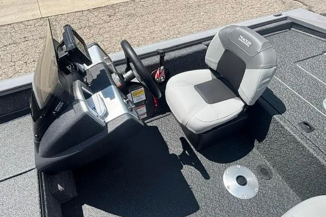 Slide: The Image of 2026 Tracker Pro Team 175 Crappie Edition boat interior with steering console and seat. - 13