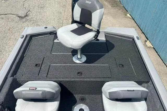 Slide: The Image of 2026 Tracker Pro Team 175 Crappie Edition boat interior with seating and storage compartments. - 18