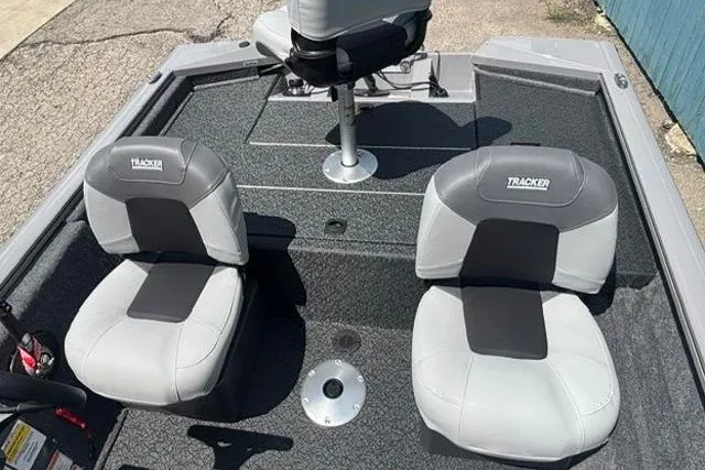 Slide: The Image of 2026 Tracker Pro Team 175 Crappie Edition boat interior with two gray seats. - 16