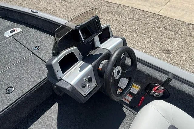 Slide: The Image of 2026 Tracker Pro Team 175 Crappie Edition boat dashboard with steering wheel and controls. - 14