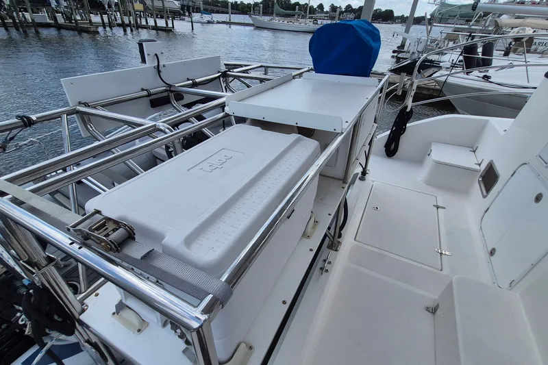 Slide: The Image of Deck view of 2005 Endeavour 44 TrawlerCat with storage and seating, docked at marina. - 64
