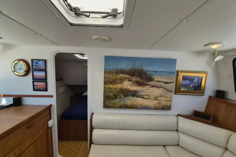 Slide: The Image of Interior of 2005 Endeavour 44 TrawlerCat with nautical decor and comfortable seating. - 25