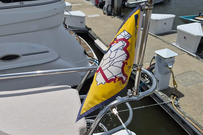 Slide: The Image of Yellow flag on Endeavour 44 TrawlerCat, docked at marina, 2005 model. - 11