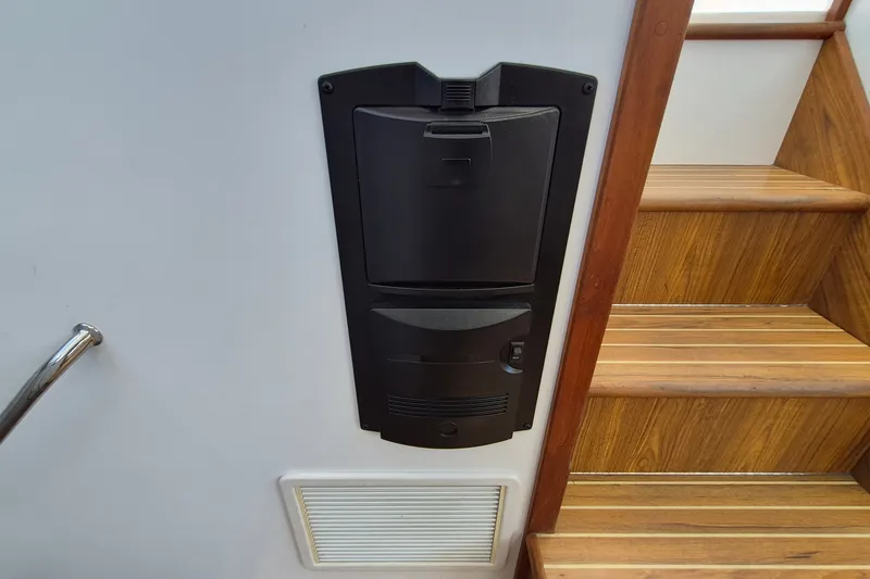 Slide: The Image of Built-in vacuum system on 2005 Endeavour 44 TrawlerCat near wooden stairs. - 23