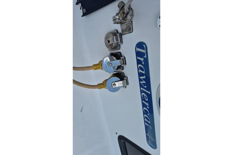 Slide: The Image of Power connections on a 2005 Endeavour 44 TrawlerCat boat with visible cables and fittings. - 67