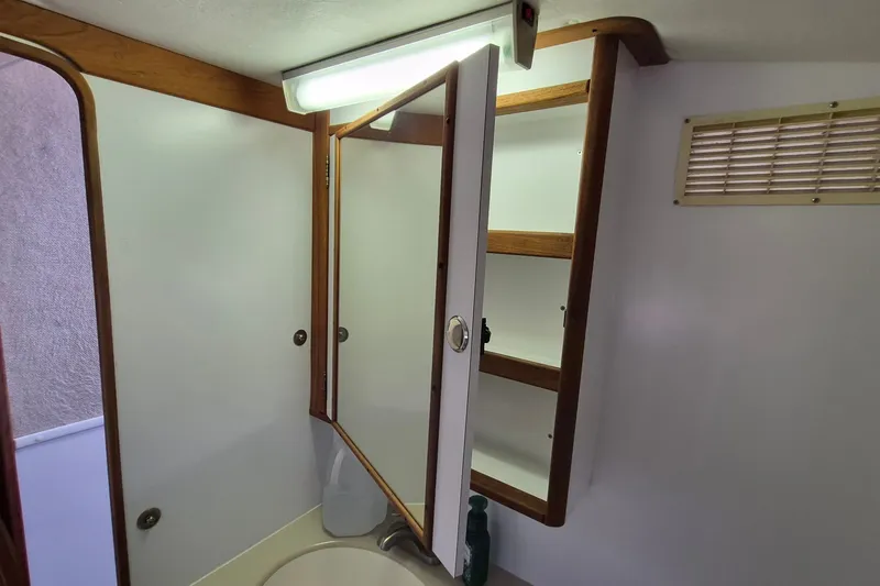 Slide: The Image of Bathroom cabinet with mirror in 2005 Endeavour 44 TrawlerCat yacht. - 33