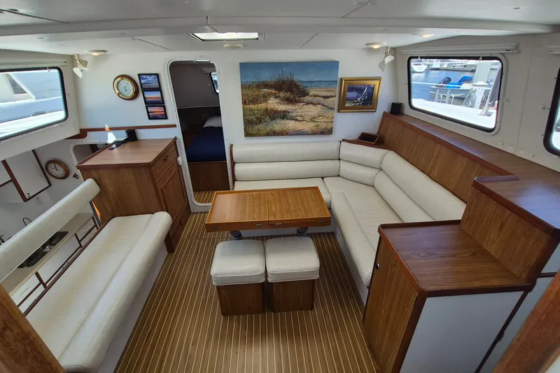 Slide: The Image of Interior of 2005 Endeavour 44 TrawlerCat with cozy seating and wooden accents. - 21