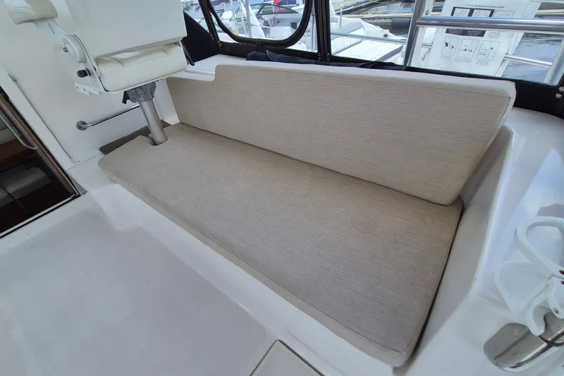 Slide: The Image of Helm seat and cushioned bench on 2005 Endeavour 44 TrawlerCat boat. - 5