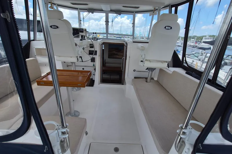 Slide: The Image of Interior of 2005 Endeavour 44 TrawlerCat with seating and helm station. - 2