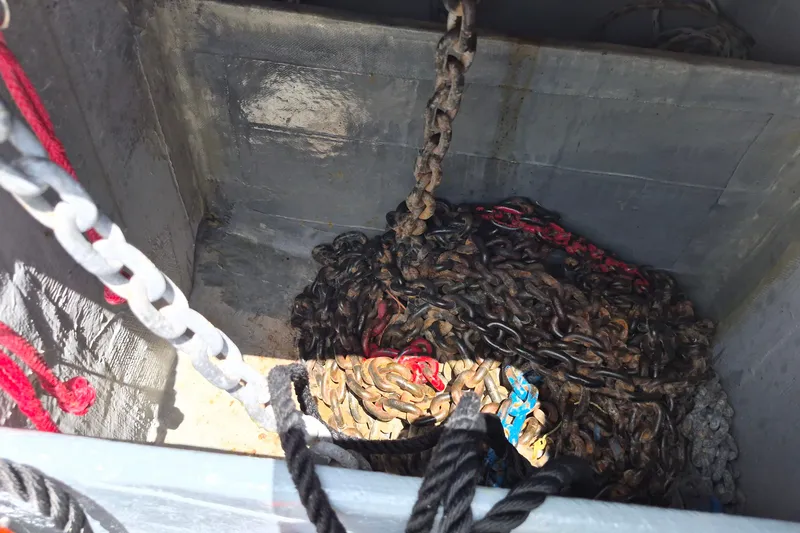 Slide: The Image of Anchor chain storage on 2005 Endeavour 44 TrawlerCat, featuring ropes and chains. - 77