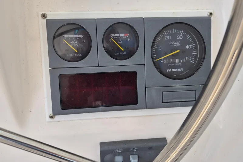 Slide: The Image of Instrument panel of a 2005 Endeavour 44 TrawlerCat, featuring gauges and controls. - 15
