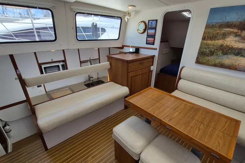Slide: The Image of Interior of 2005 Endeavour 44 TrawlerCat with seating, table, and kitchenette. - 24