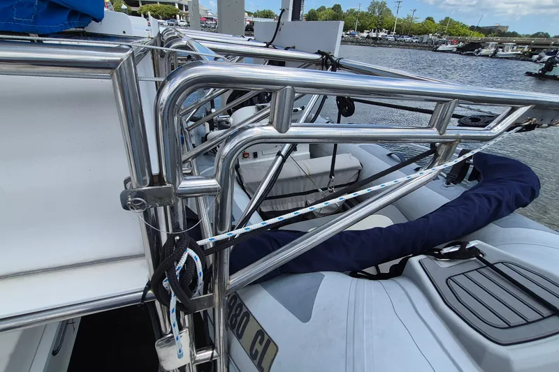 Slide: The Image of Stainless steel railing on 2005 Endeavour 44 TrawlerCat boat, docked by the water. - 62