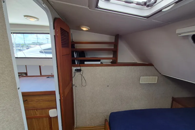 Slide: The Image of Interior cabin of 2005 Endeavour 44 TrawlerCat with wooden accents and skylight. - 30