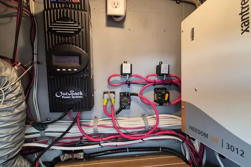 Slide: The Image of Electrical system setup in a 2005 Endeavour 44 TrawlerCat, featuring OutBack and Xantrex components. - 81