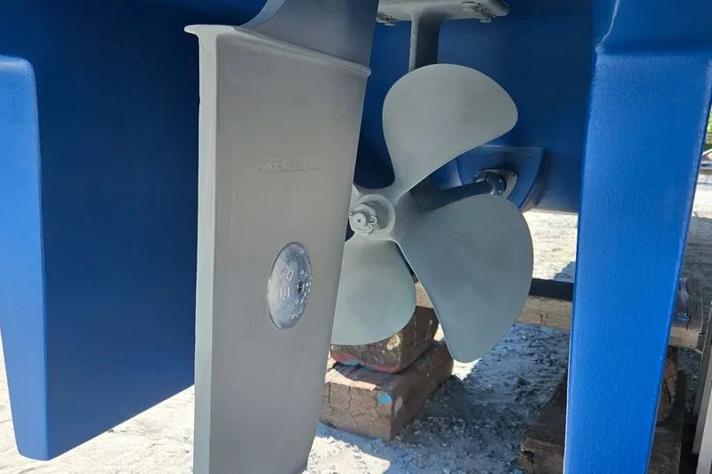 Slide: The Image of Propeller and rudder of 2005 Endeavour 44 TrawlerCat, displayed on dry dock. - 85