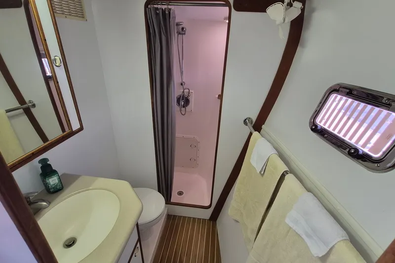 Slide: The Image of Bathroom interior of 2005 Endeavour 44 TrawlerCat with shower, sink, and towels. - 31