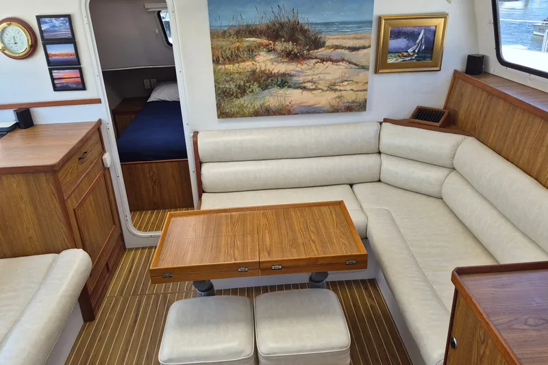 Slide: The Image of Interior of 2005 Endeavour 44 TrawlerCat with cozy seating and nautical decor. - 20