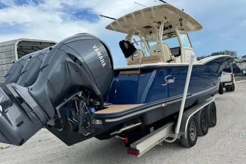 Slide: The Image of 2017 Scout 350 LXF boat with Yamaha engines on a trailer. - 50