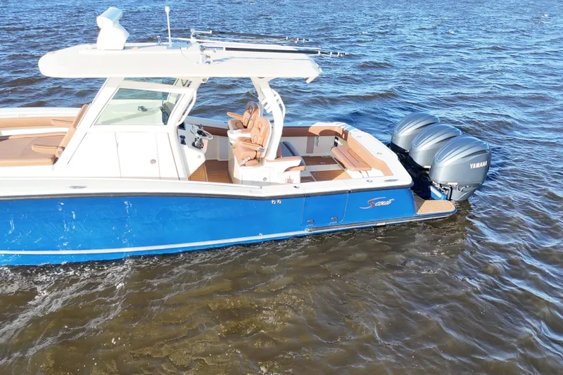 Slide: The Image of 2017 Scout 350 LXF boat with Yamaha engines on water. - 42