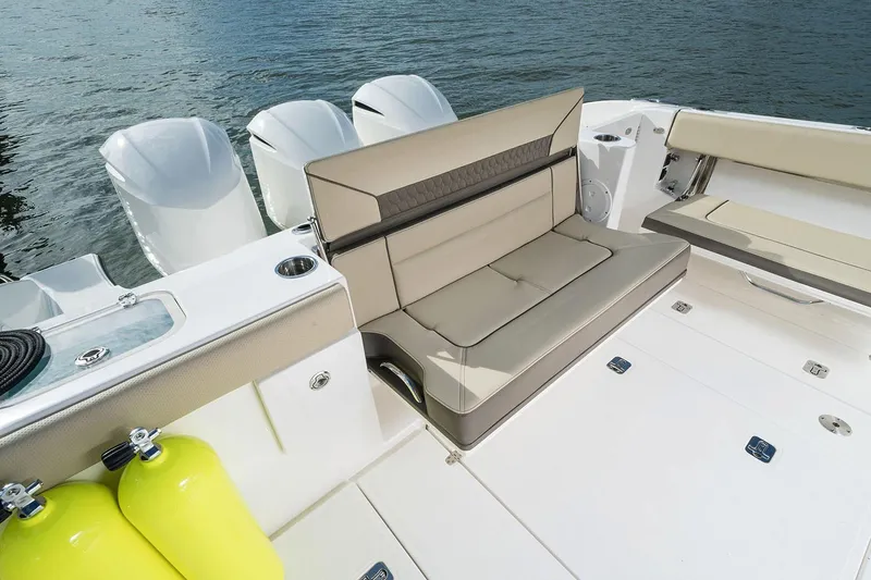 Slide: The Image of Manufacturer Provided Image: 2025 Pursuit DC 365 Dual Console boat interior with seating and engines. - 19