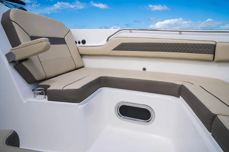 Slide: The Image of Manufacturer Provided Image: 2025 Pursuit DC 365 Dual Console boat interior with cushioned seating and cup holder. - 7