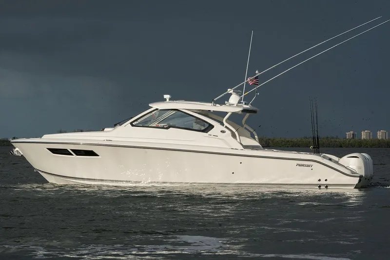 The Image of Manufacturer Provided Image: 2025 Pursuit DC 365 Dual Console boat on water under cloudy sky. - 4