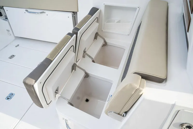 Slide: The Image of Manufacturer Provided Image: 2025 Pursuit DC 365 Dual Console boat interior with open storage compartments and seating. - 17