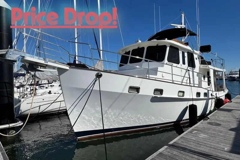 The Image of 2008 Kadey-Krogen 44 Walk Around yacht docked, with "Price Drop" text overlay. - 0