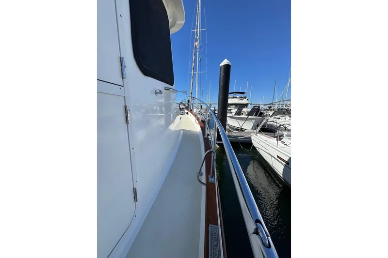 Slide: The Image of 2008 Kadey-Krogen 44 Walk Around yacht docked in marina, side view. - 24